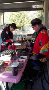 Tomomi Katz cooking takoyaki at her food booth